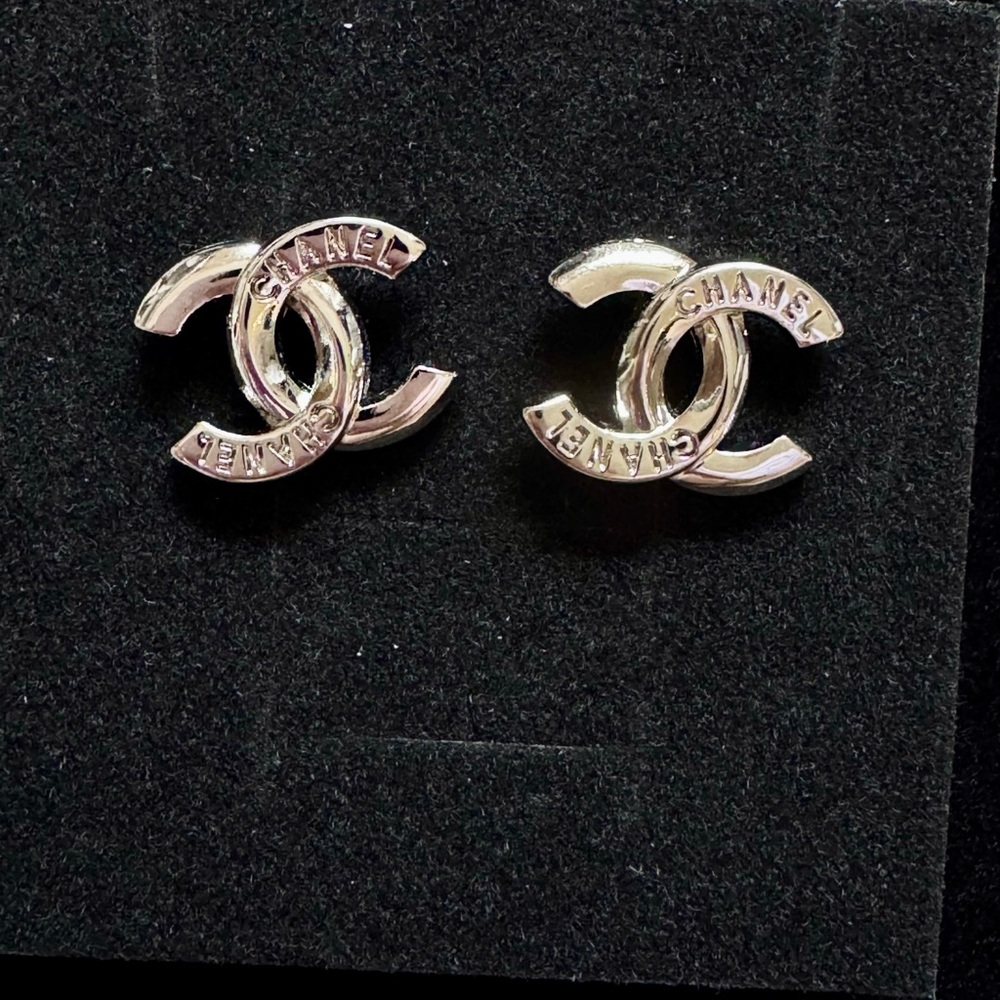 Chanel Silver Interlocking Cc Logo Stud Earrings - image 1